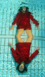 Red reflection in the pool by Adolfo Maciocco 